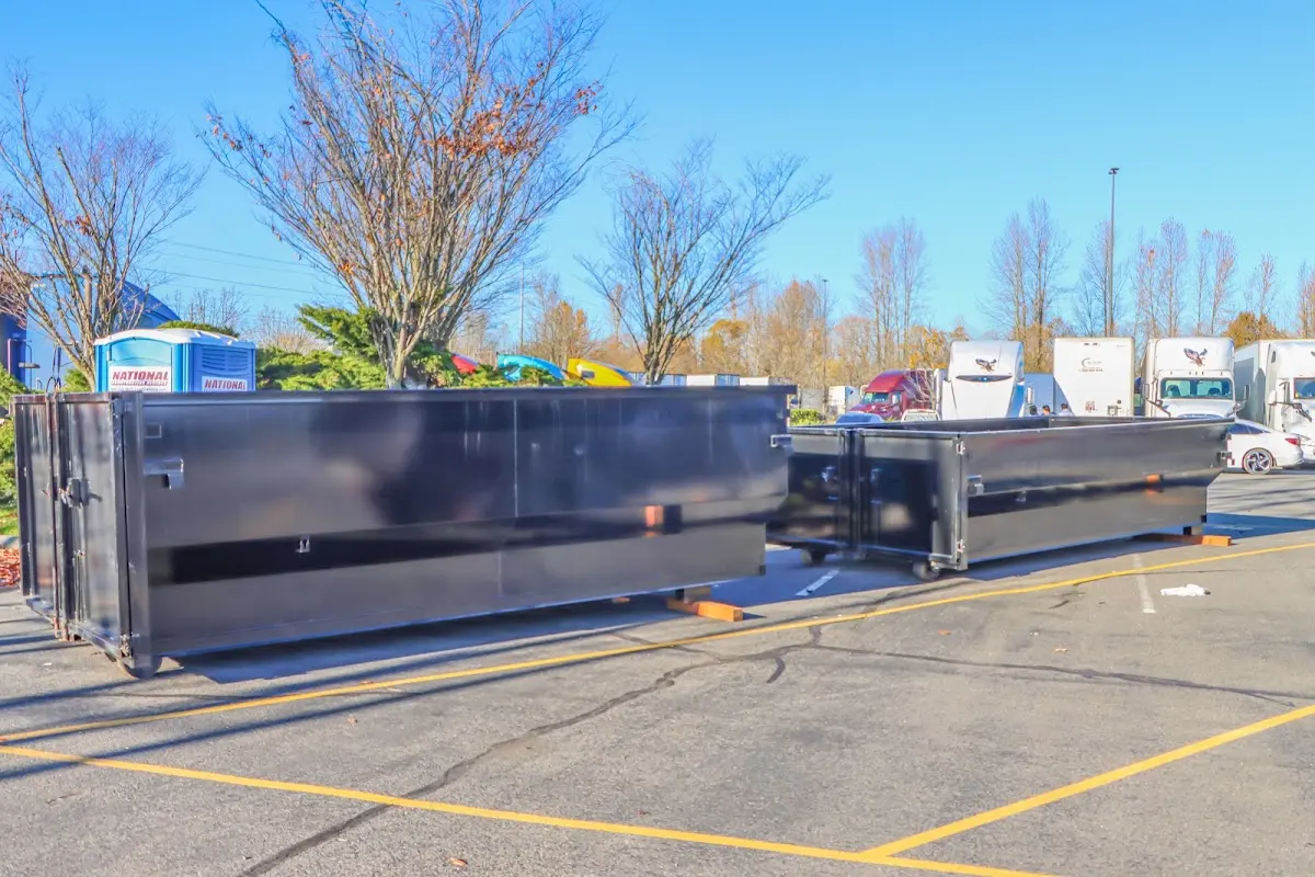 Professional dumpster rental service with roll-off container on residential driveway in Calabasas